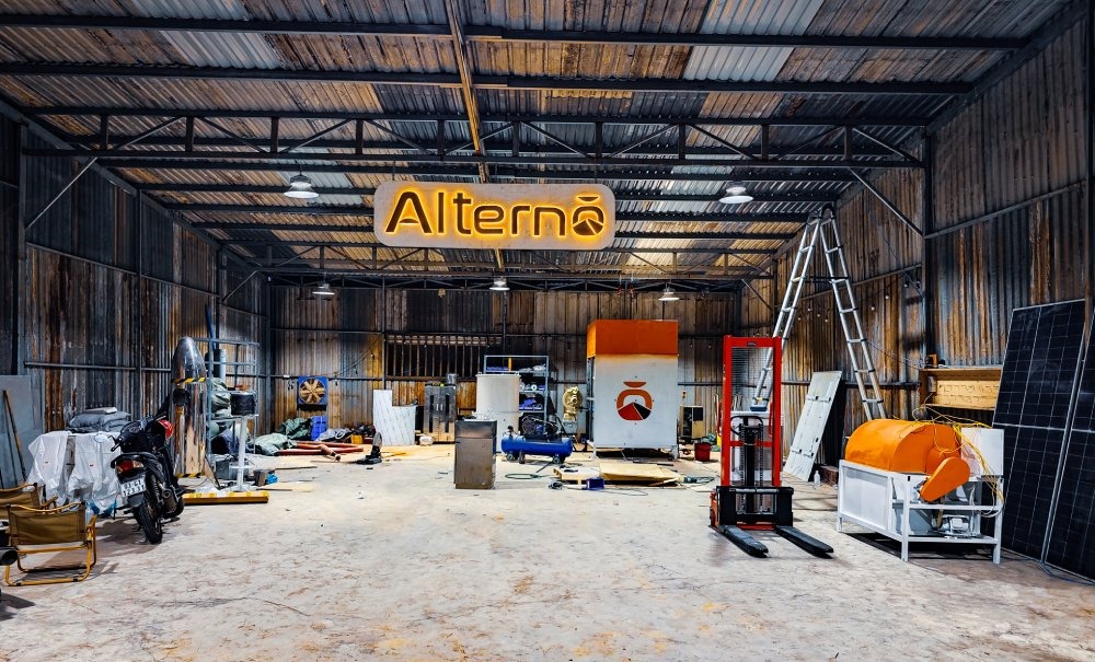 Interior view of the sand battery prototype, thermal enclosure, forklift, solar panels, and hardware setup
