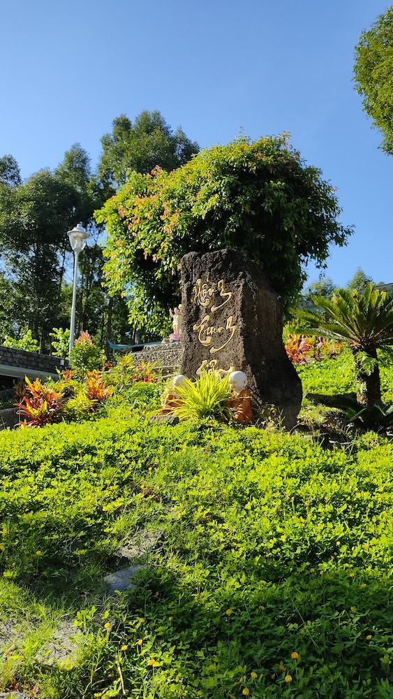 Stone shrine and monk figurines in the temple garden