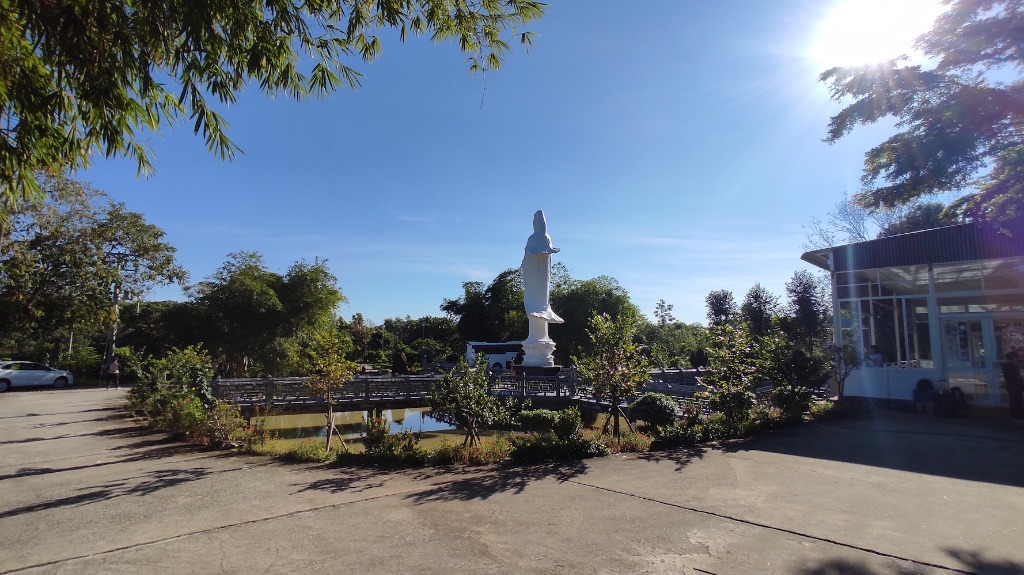 Sunlight over the temple grounds and pond on the final morning